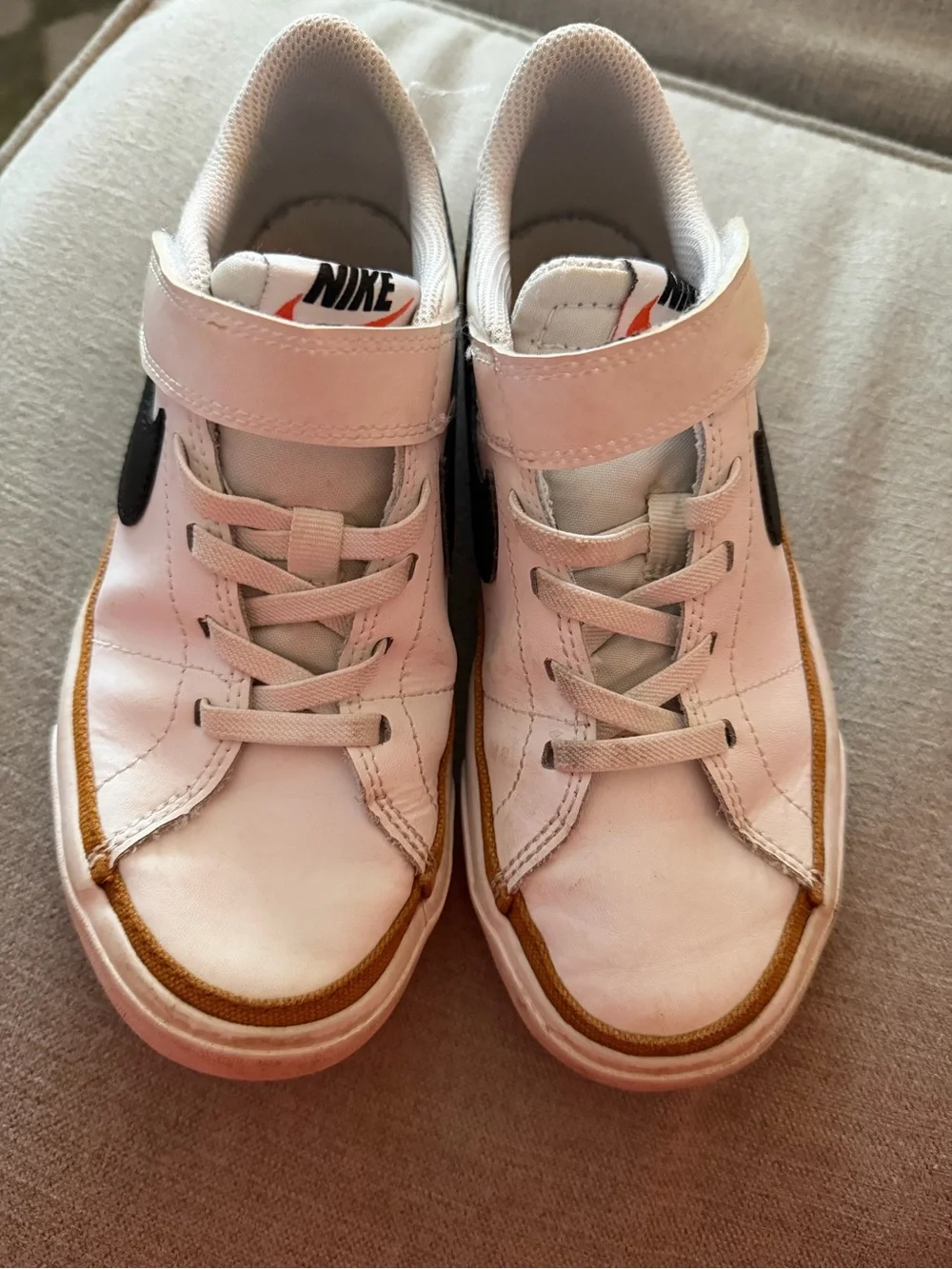 Nike White Sneakers with Black Swoosh and Tan Stripe